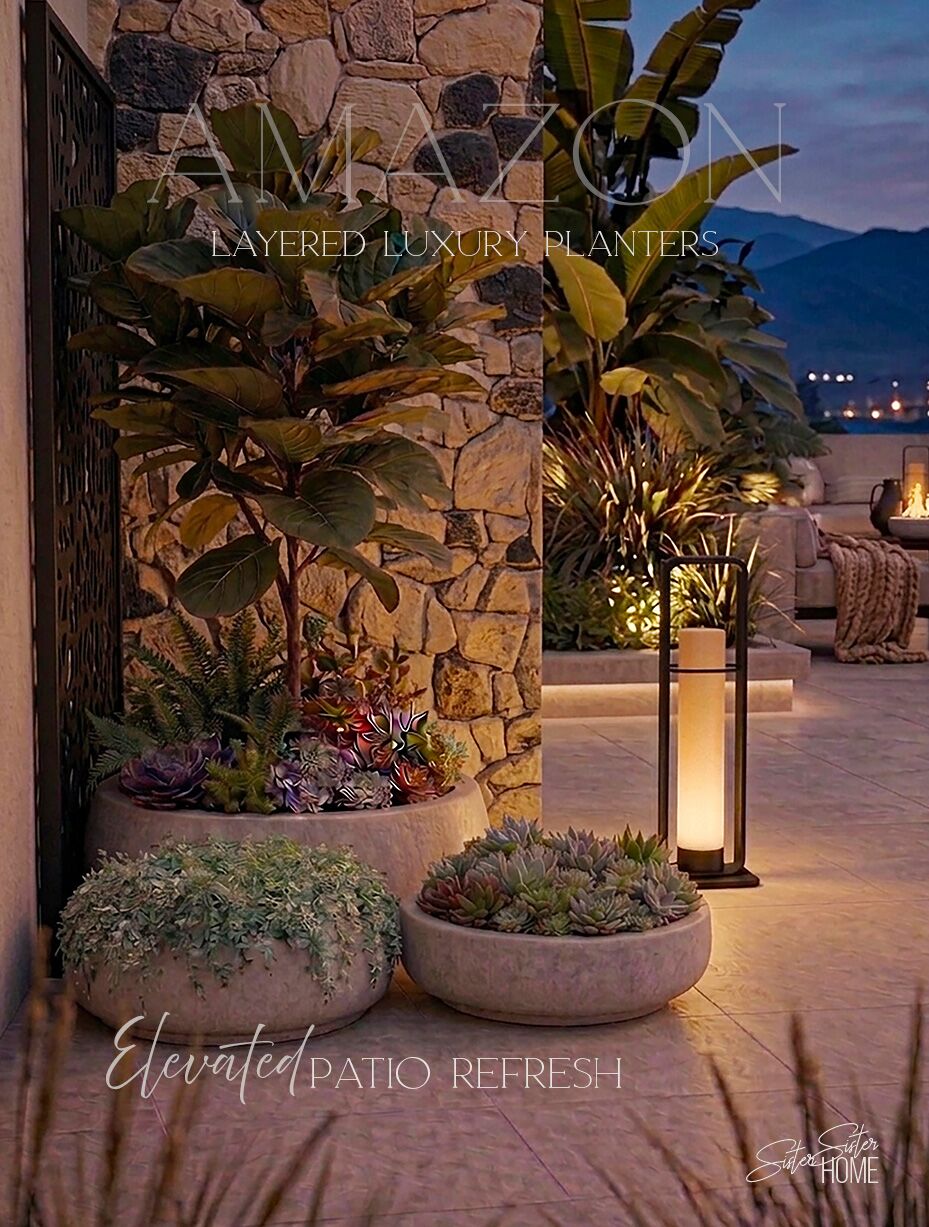 Layered outdoor concrete planters styled on a modern patio with warm lighting, featuring lush greenery and succulents in low-profile round pots.