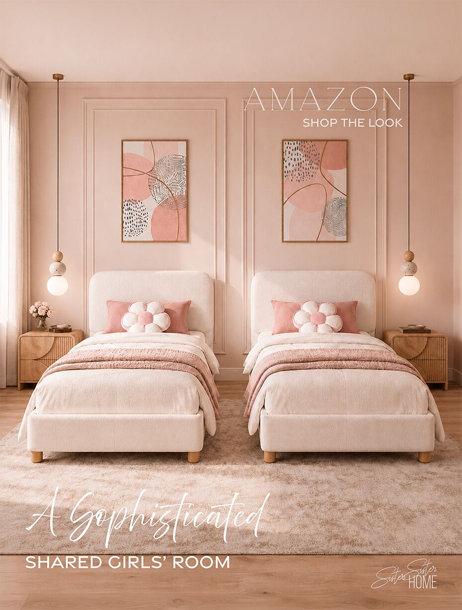 Sophisticated shared girls’ room with twin cream bouclé beds, blush bedding, floral pillows, natural oak nightstands and pendant lights.